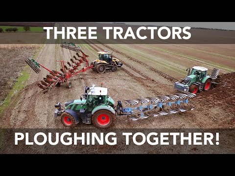 Three Tractors Ploughing Together