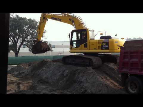 Komatsu 200LC excavator loading truck